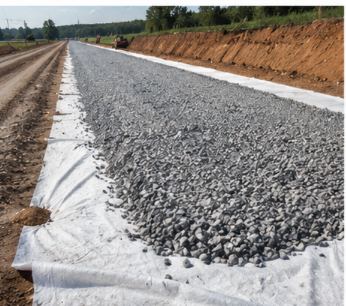 Geotextile separation layer beneath road aggregate