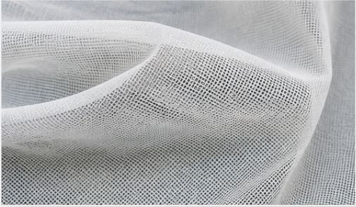 Close-up of white knitted insect net fabric